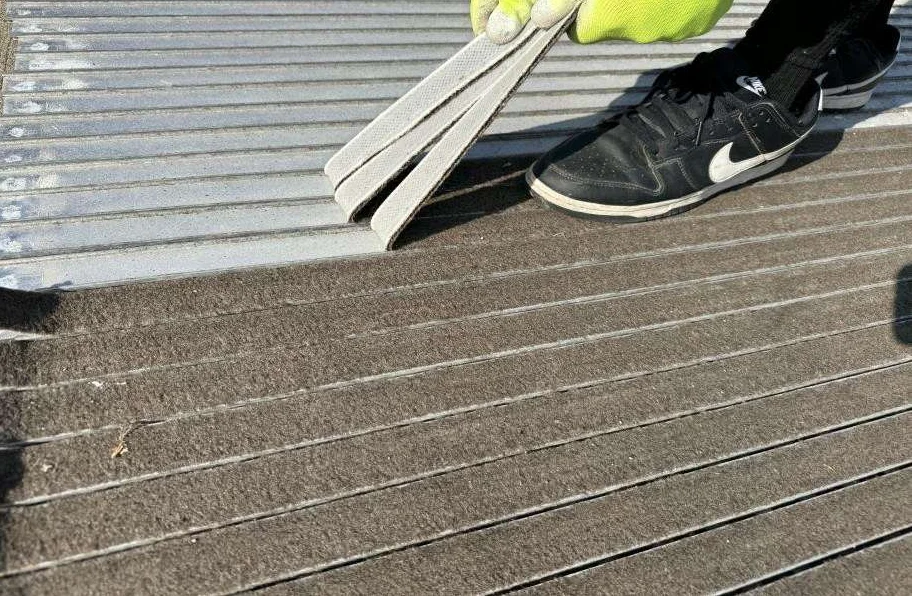 Removing the existing carpet inserts after loosening the rivets